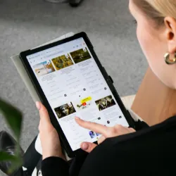 Looking over shoulder of Woman on tablet