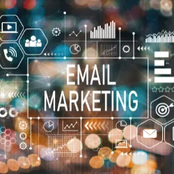 Background blurred with Email Marketing in center with various icons around.